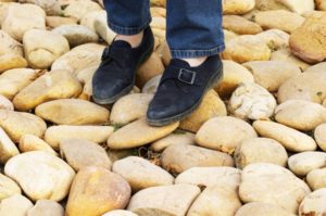 Two feet in a stony vineyard