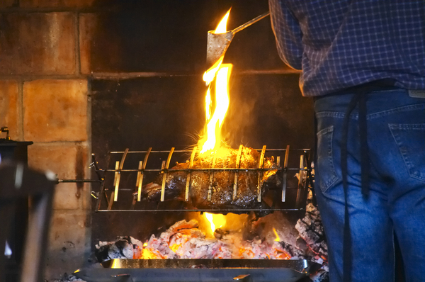 The grilled leg of lamb is getting ready