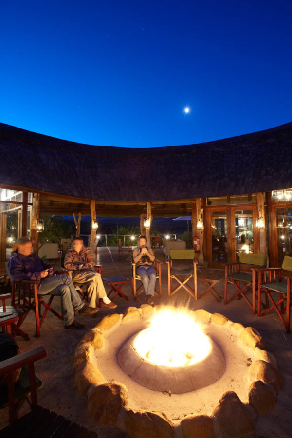 Relaxing at the safari lodge around the fire before dinner