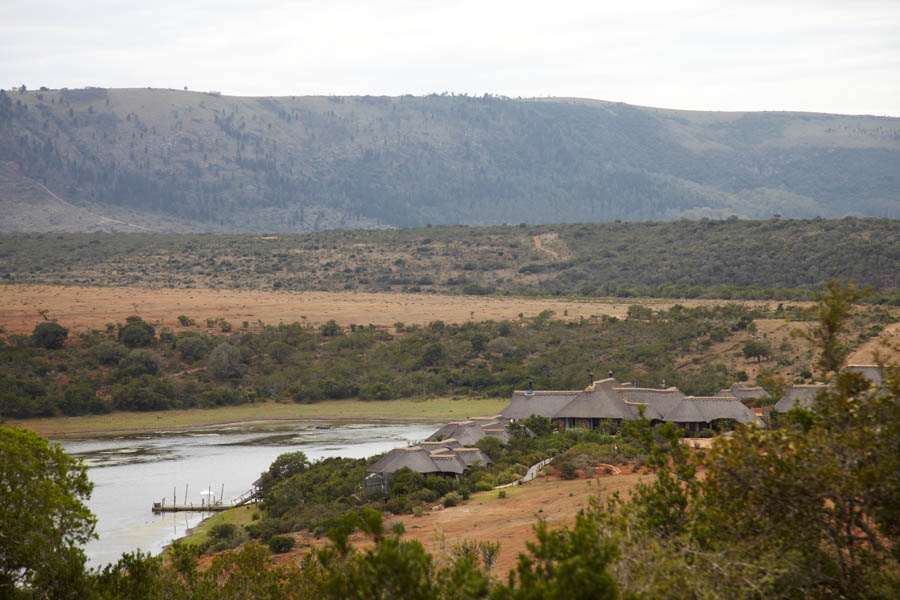 One of the safari lodges by a lake at the foot of the hills