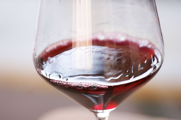 A glass of full-bodied Bardolino wine in northern Italy