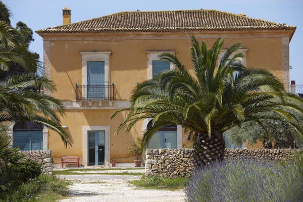 A Sicilian villa with palm trees