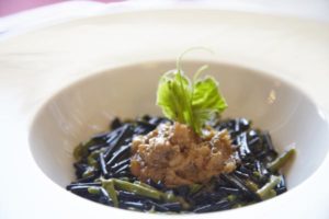 A Sicilian speciality: rabbit stew and black rice