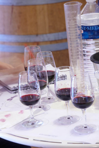 Base wines, measuring glass and glasses for blending workshop