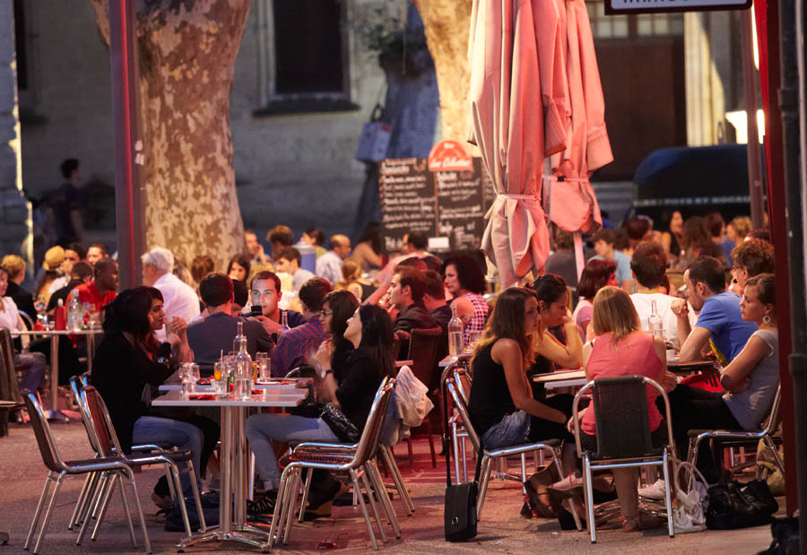 People on the terraces of the cafés