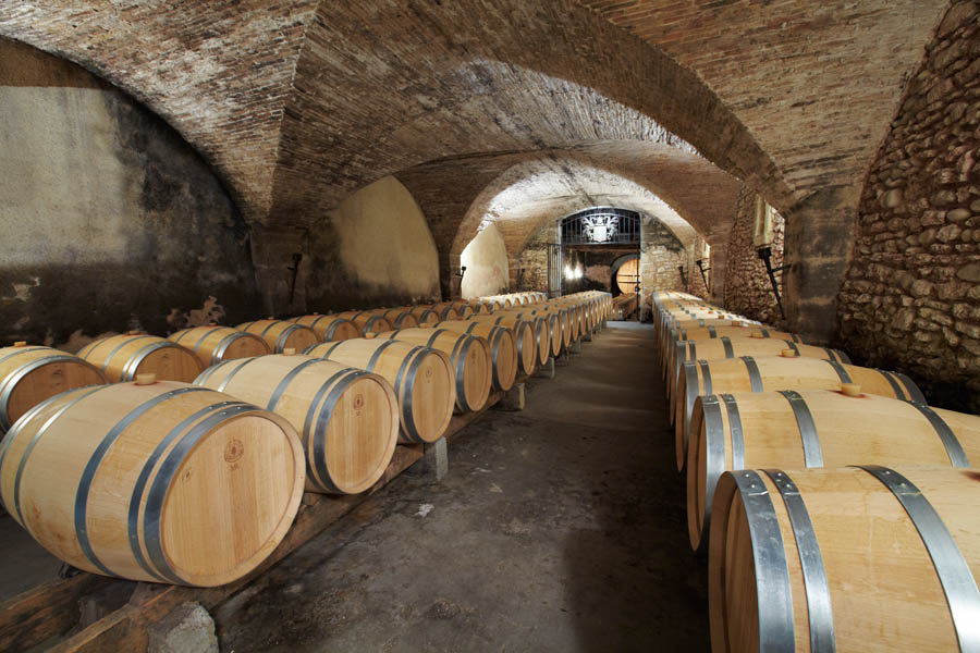 An old wine cellar with oak barrels in the Rhone Valley