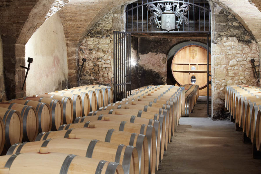 An old wine cellar with oak barrels in the Rhone Valley