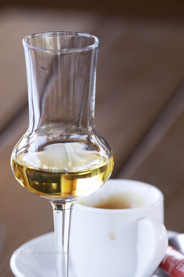 Glass of aged grappa with coffee