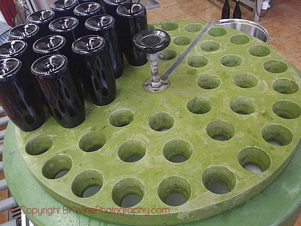 Sparkling wine bottles in a cooling bath