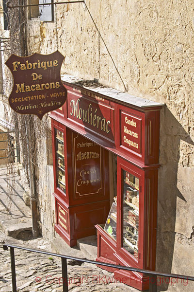 A steep cobble stone street and macaron shop, Saint Emilion