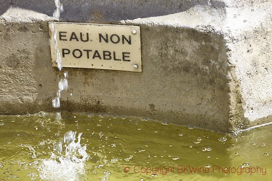 A fountain with a sign "not drinking water", in Champagne