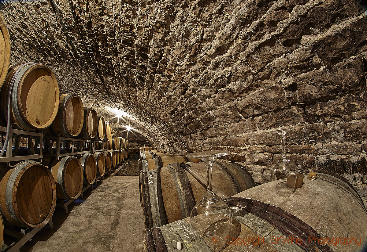Barrels with ageing wine, in a cellar in Champagne