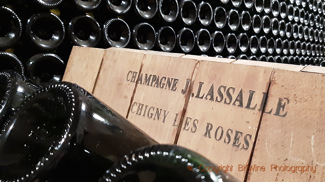 Bottles in a pupitre in the cellar of Champagne J Lassalle