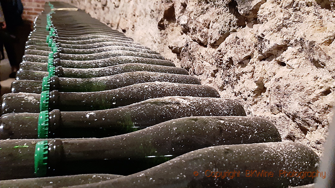 Bottles in the cellar of Champagne J Lassalle