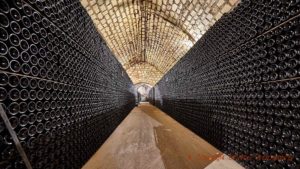 Many thousands of bottles resting in a cellar in Champagne