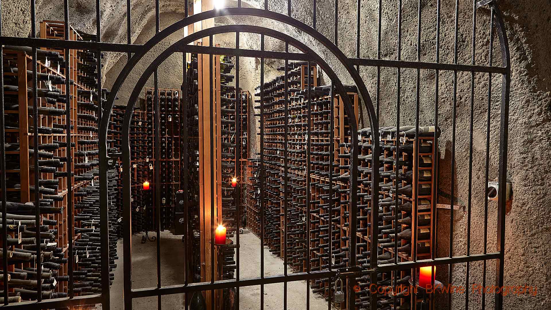 A collection of old bottles in a winery cellar