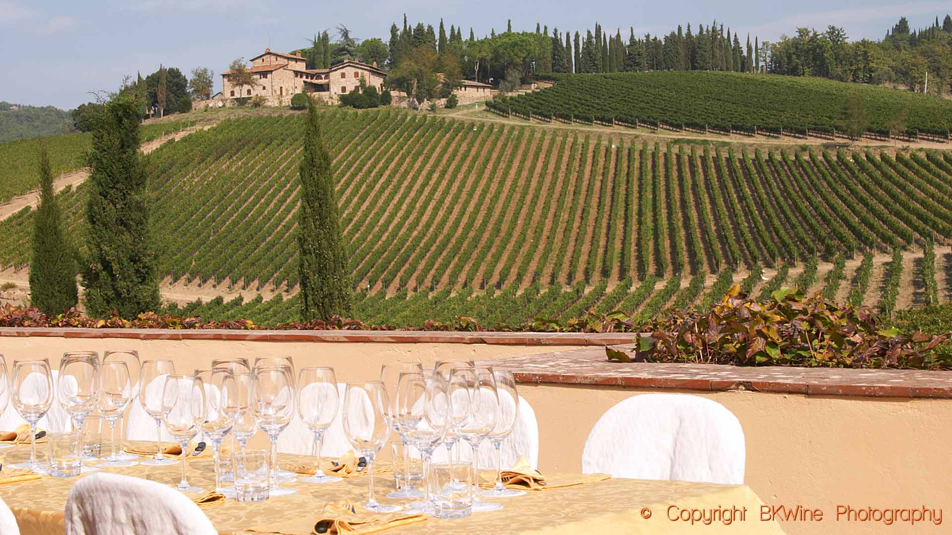 Lunch is ready on the terrace with a view over the Tuscan vineyards