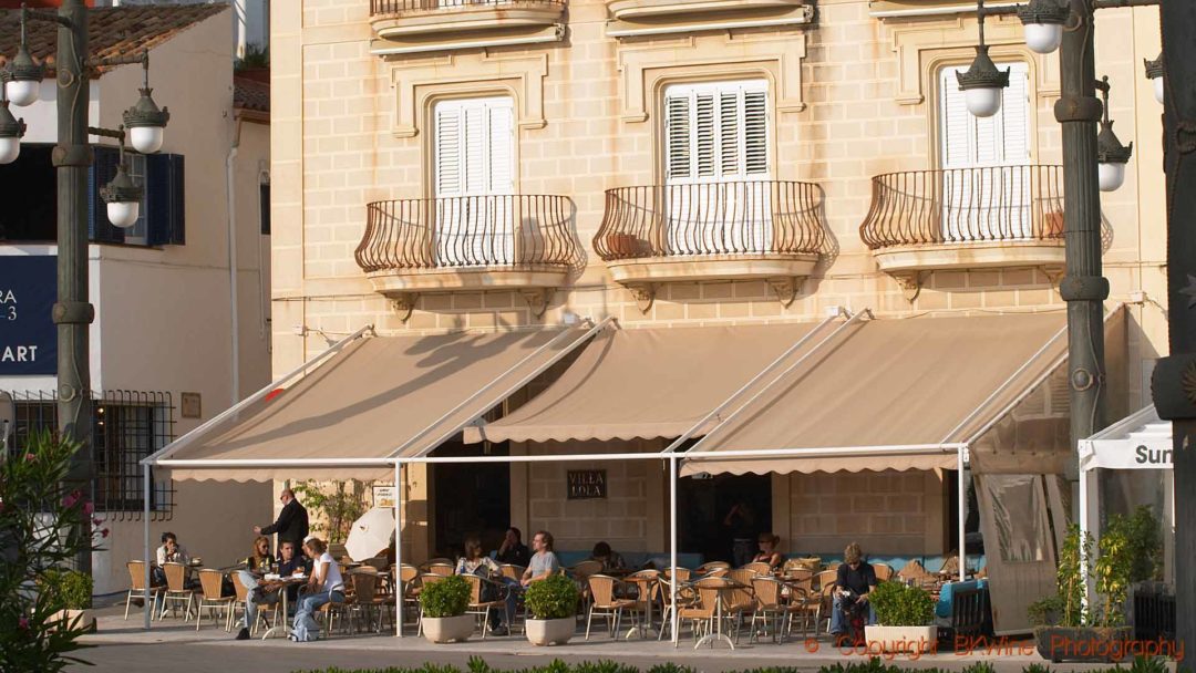 Enjoying the afternoon sunshine at a café in Sitges, Catalonia