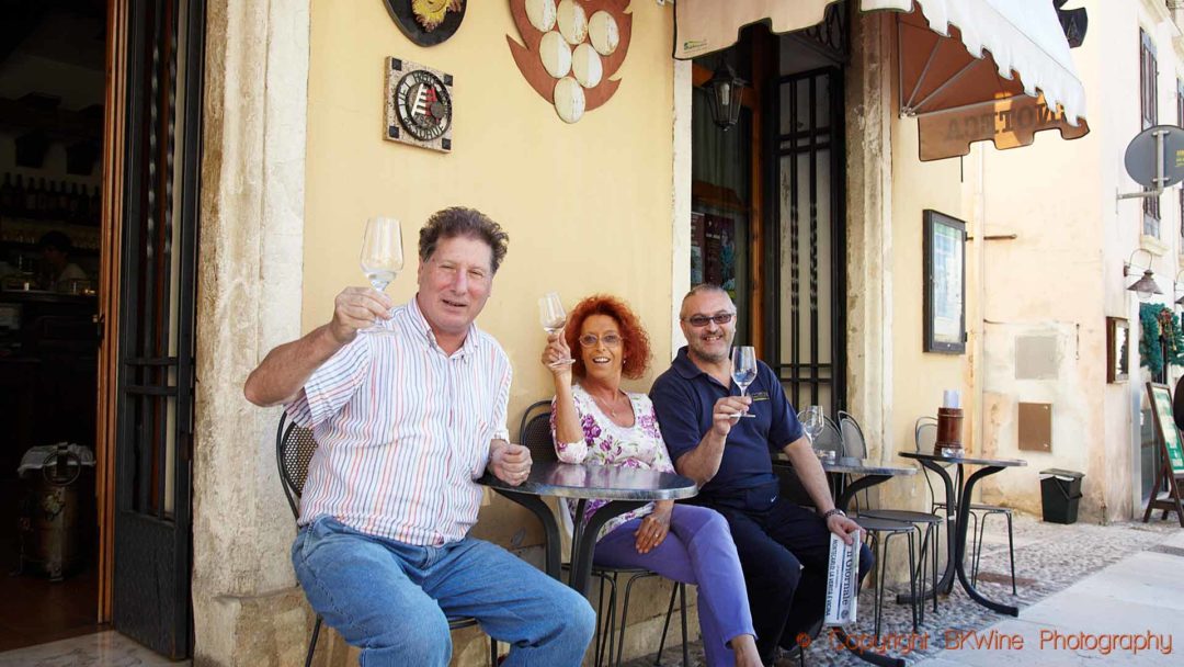 Welcome to share a glass of soave in a street-side café