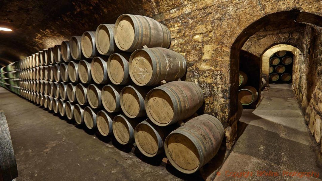 Stacks of wine barrels in an old wine cellar in Rioja