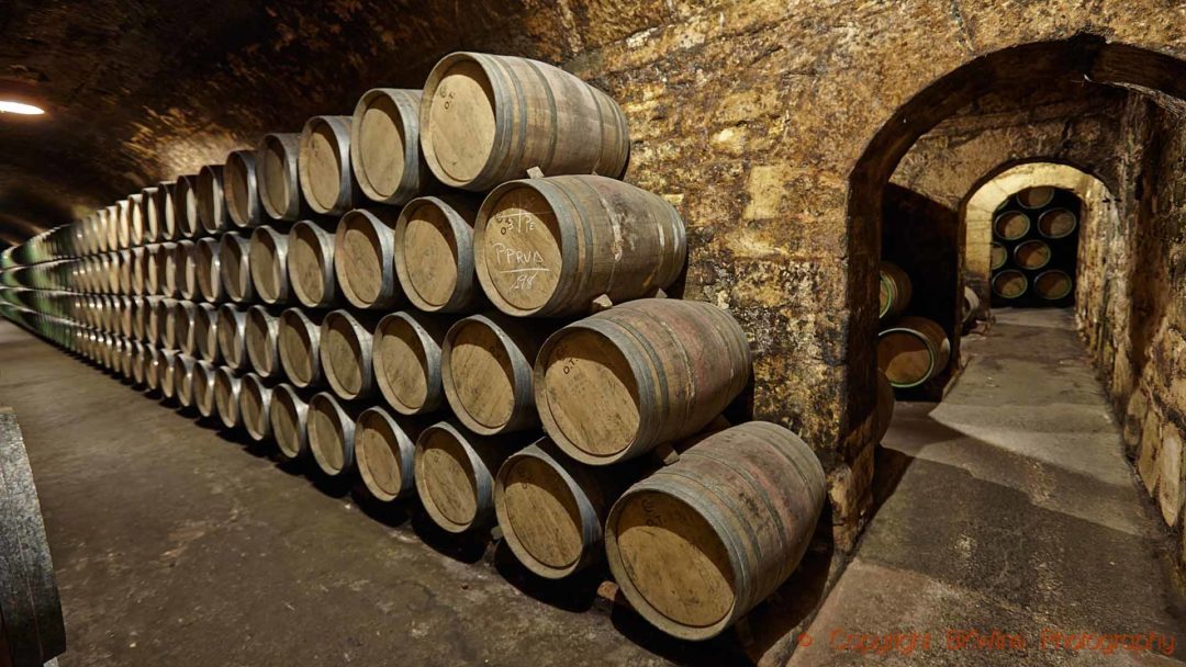 Stacks of wine barrels in an old wine cellar in Rioja