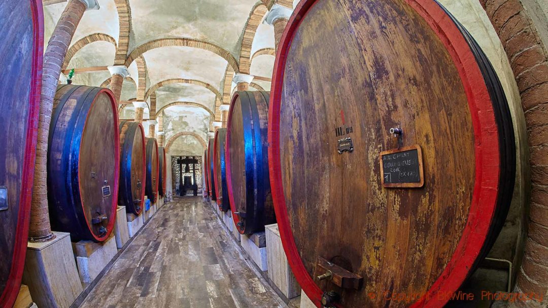 Big oak barrels, botti, in a wine cellar in Tuscany