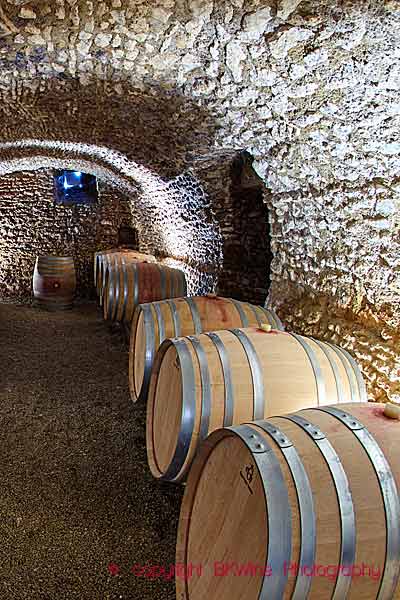 A wine cellar with oak barrels at a vineyard in the Loire Valley