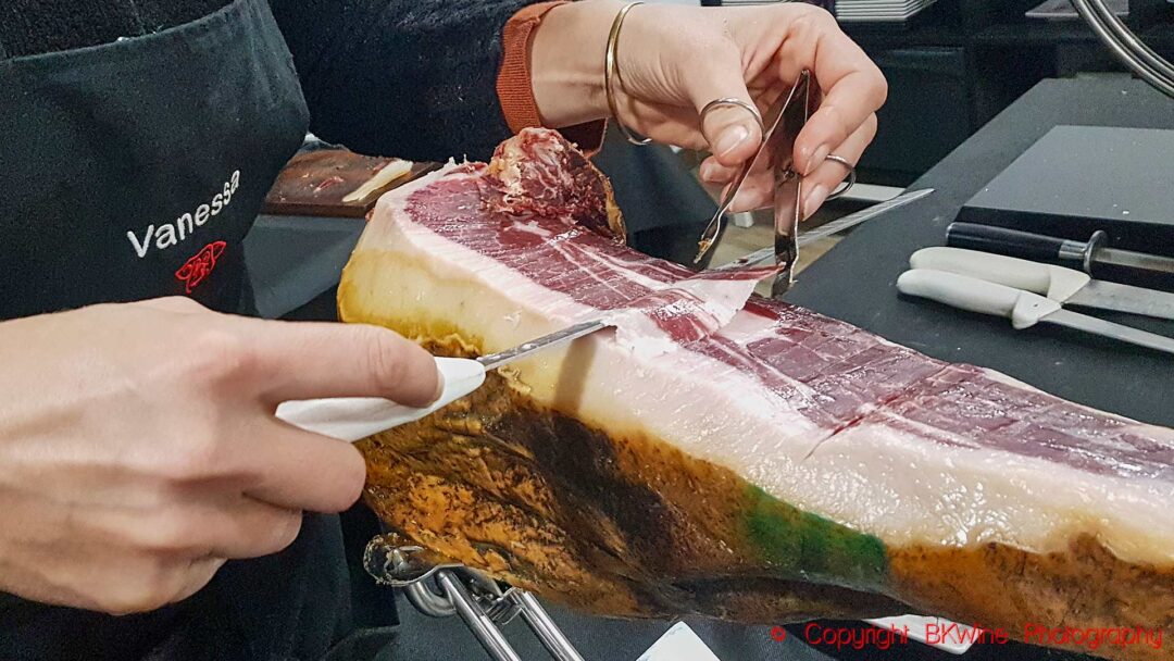 Cutting very thin slices of Spanish ham, jamon iberico, Andalusia