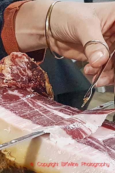 Cutting very thin slices of Spanish ham, jamon iberico, Andalusia
