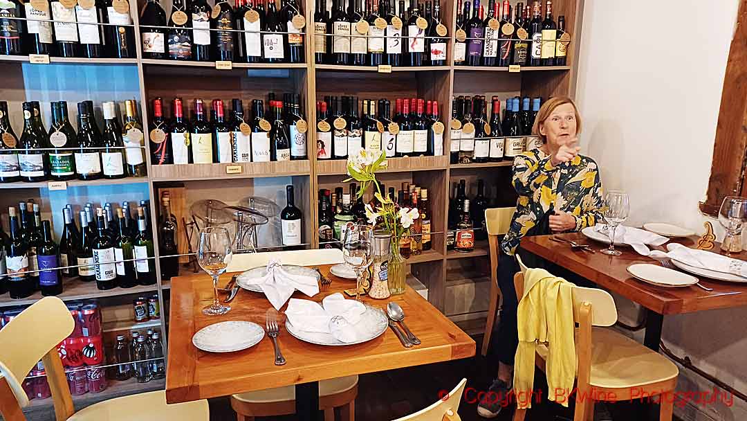 At the Don Emelio Restaurante in Vin a del Mar, Chile, with the wine list and shop on the wall